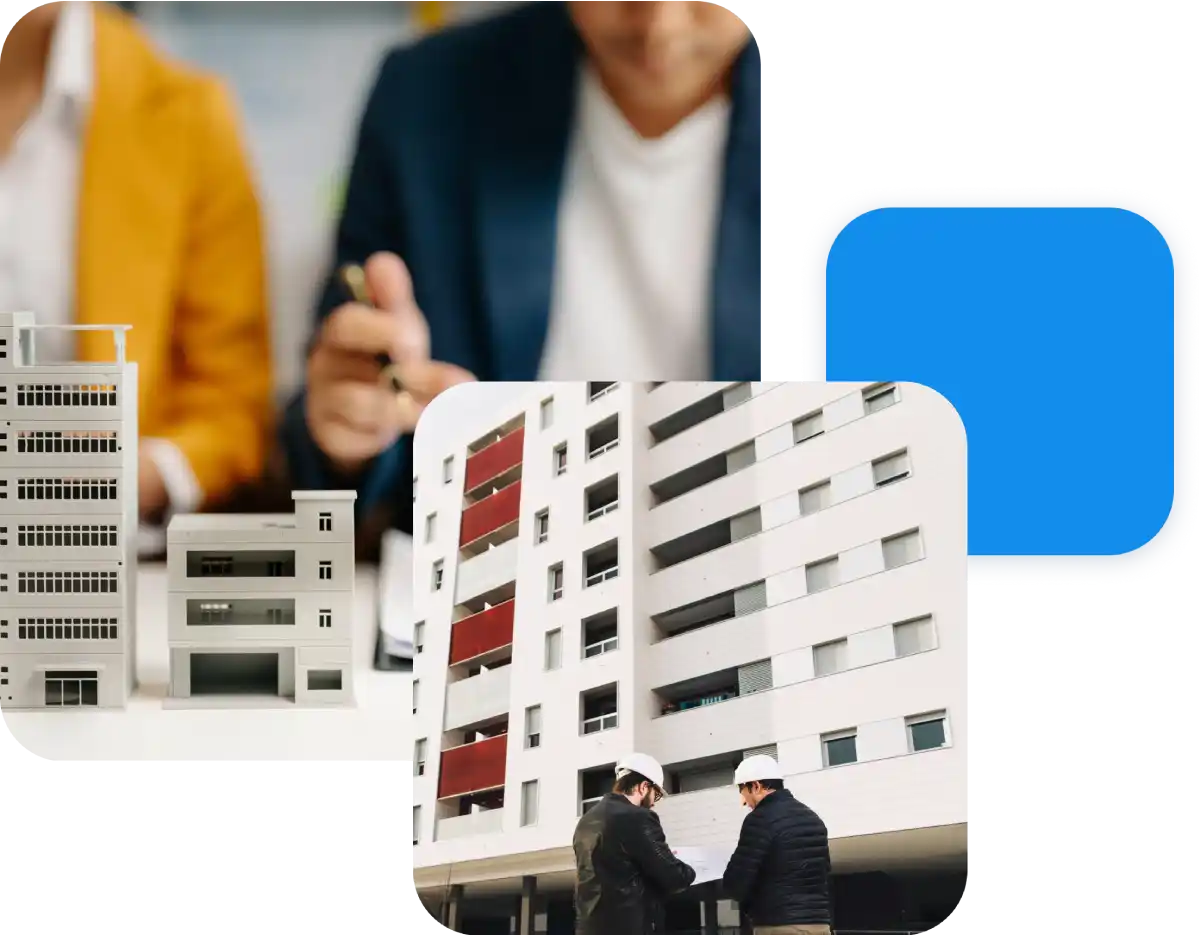 Modelli architettonici in primo piano con uomini in giacca e casco valutano progetto edilizio.